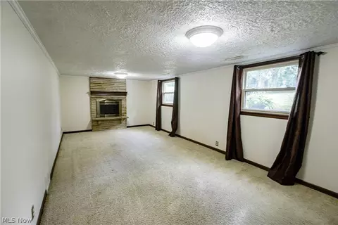 Living - 1416 Dunkeith Dr NW, Canton, OH 44708 photo 8 of 10