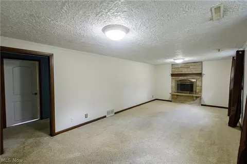 Living - 1416 Dunkeith Dr NW, Canton, OH 44708 photo 9 of 10