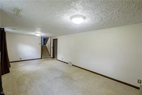 Living - 1416 Dunkeith Dr NW, Canton, OH 44708 photo 10 of 10