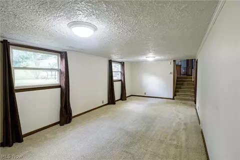 Living - 1416 Dunkeith Dr NW, Canton, OH 44708 photo 7 of 10