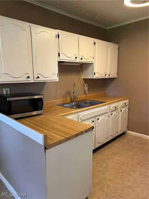 Kitchen - 56 E Ashtabula St, Jefferson, OH 44047 photo 2 of 6