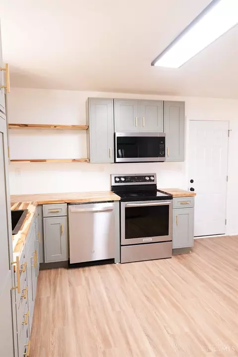 Kitchen - 60 Maple St, Mowrystown, OH 45155 photo 2 of 3