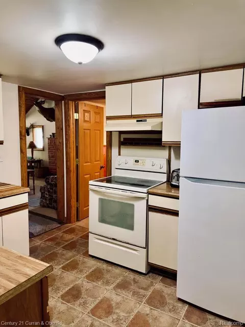 Kitchen - 111 Petoskey Dr, Roscommon, MI 48653 photo 2 of 3