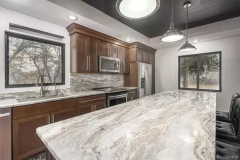 Kitchen - 6803 Napoleon Rd, Leoni, MI 49201 photo 2 of 9