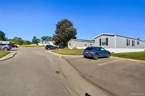 Exterior - 230 E Macgregor Ct, Highland, MI 48357 photo 4 of 8