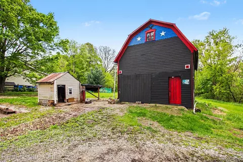 Exterior - 103 Stockbridge St, Unadilla, MI 48137 photo 5 of 7