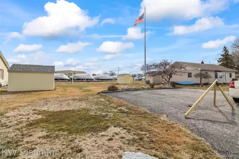 7825 Alexandria Dr, Ira, MI 48023