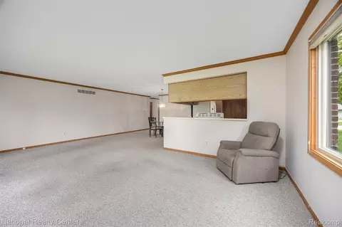 Living - 16061 Meadows Dr, Macomb, MI 48044 photo 2 of 4