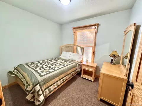 Bedroom - 10931 Roberts Rd N, Maple Forest, MI 49733 photo 2 of 3