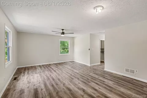 Living - 1253 Harper Rd, Alaiedon, MI 48854 photo 5 of 6