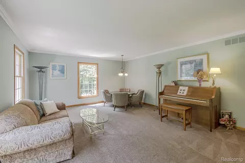 Living - 2411 Farmbrook Trl, Addison, MI 48370 photo 3 of 4