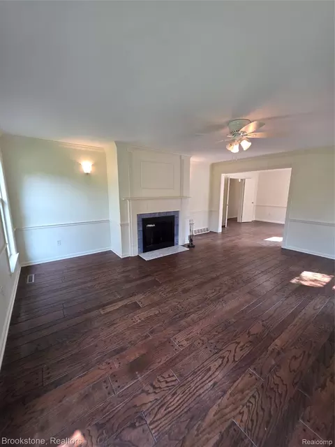 Living - 1210 Springborrow Dr, Flint, MI 48532 photo 3 of 4