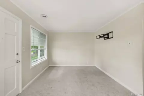 Living - 4409 Cuthbertson St, Flint, MI 48507 photo 2 of 4