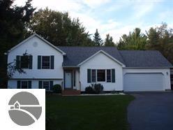 7646 Hampton Cir, Grawn, MI 49637 photo 1