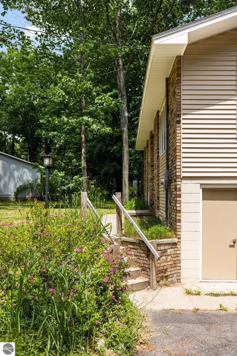 Exterior - 1513 Melody Ln, Interlochen, MI 49643 photo 8 of 15