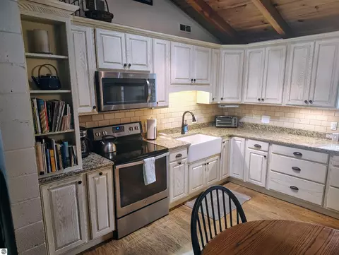 Kitchen - 100 Hemlock Rd, Roscommon, MI 48653 photo 3 of 6