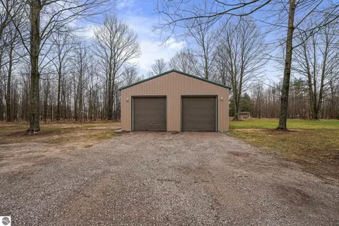 Exterior - 11337 Riley Rd, Interlochen, MI 49643 photo 2 of 7