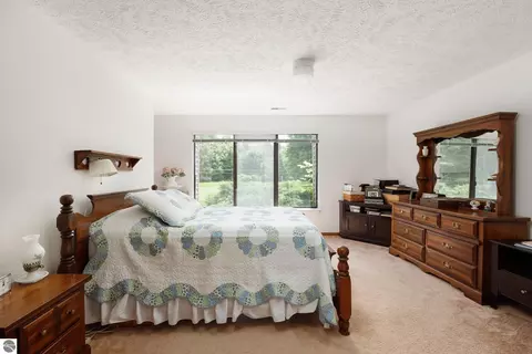 Bedroom - 11255 E Fort Rd #E-2, Suttons Bay, MI 49682 photo 2 of 5