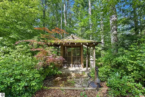 Exterior - 9948 Harmony Dr, Interlochen, MI 49643 photo 7 of 16