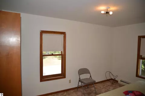 Bedroom - 114 W Second St, Elk Rapids, MI 49629 photo 7 of 9