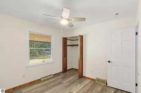 Bedroom - 10076 Harmony Dr, Interlochen, MI 49643 photo 6 of 6