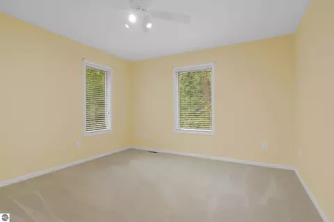 Bedroom - 151 Dubonnet Trl, Interlochen, MI 49643 photo 8 of 8