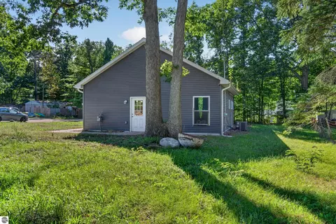Exterior - 9722 Fourth St, Interlochen, MI 49643 photo 4 of 5