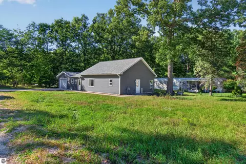 Exterior - 9722 Fourth St, Interlochen, MI 49643 photo 2 of 5