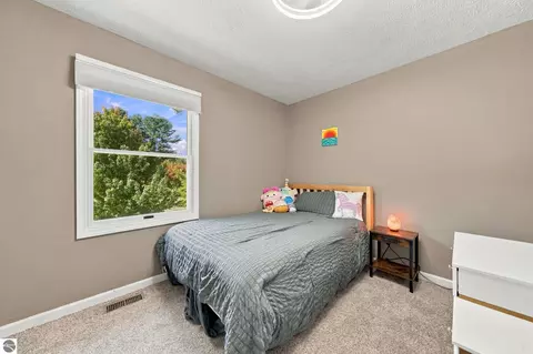 Bedroom - 707 Pine St, Elk Rapids, MI 49629 photo 8 of 10