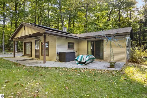 Exterior - 8702 Deadstream Rd, Honor, MI 49640 photo 3 of 10
