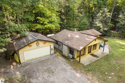 Exterior - 8702 Deadstream Rd, Honor, MI 49640 photo 4 of 10