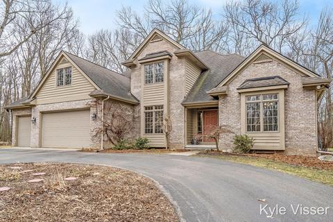 507 Roundtree Dr NE, Ada, MI 49301 photo 1