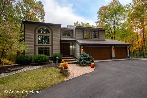 7750 Sun Quest Ridge Dr NE, Ada, MI 49301