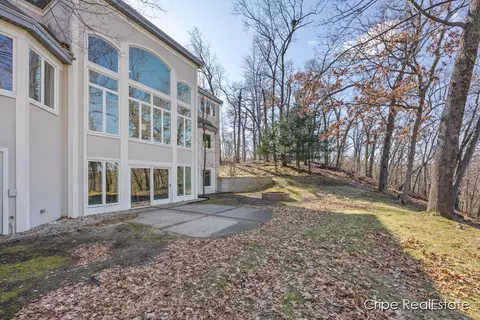 Exterior - 4844 Summer Ridge Ct NE, Ada, MI 49301 photo 10 of 17