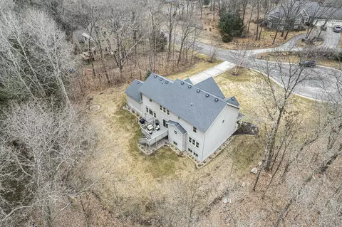 Exterior - 1419 Conservancy Ct NE, Ada, MI 49301 photo 2 of 15