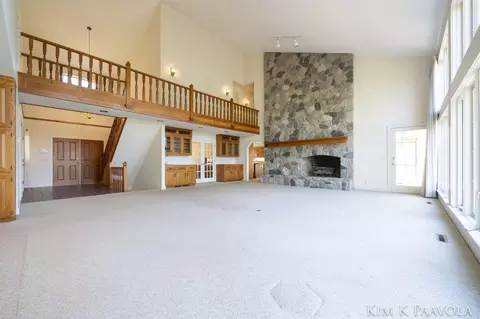 Living - 7675 Timber Bluff Rd SE, Ada, MI 49301 photo 2 of 10