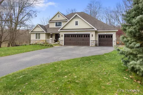Exterior - 8937 Conservancy Dr NE, Ada, MI 49301 photo 3 of 17