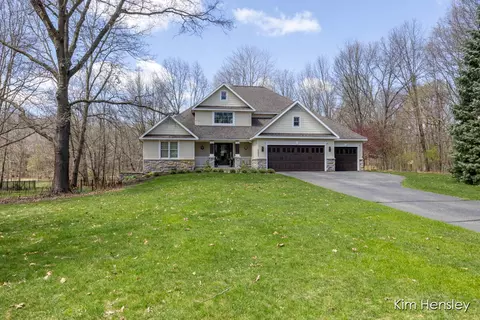 Exterior - 8937 Conservancy Dr NE, Ada, MI 49301 photo 7 of 17