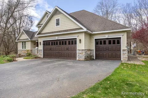 Exterior - 8937 Conservancy Dr NE, Ada, MI 49301 photo 2 of 17