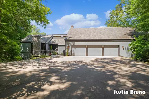 Exterior - 650 Greentree Ln NE, Ada, MI 49301 photo 2 of 14