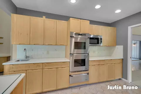 Kitchen - 650 Greentree Ln NE, Ada, MI 49301 photo 1 of 4