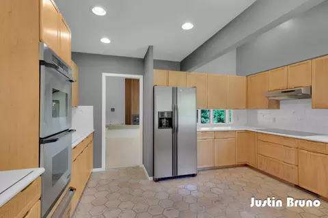 Kitchen - 650 Greentree Ln NE, Ada, MI 49301 photo 2 of 4