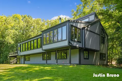 Exterior - 650 Greentree Ln NE, Ada, MI 49301 photo 4 of 14