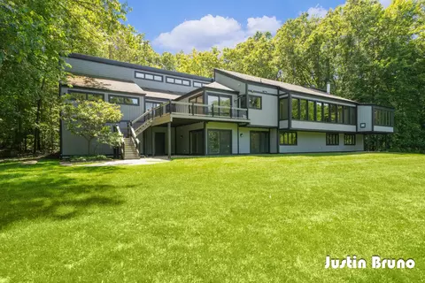 Exterior - 650 Greentree Ln NE, Ada, MI 49301 photo 3 of 14