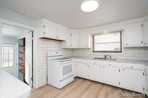 Kitchen - 418 Elm St SE, Lowell, MI 49331 photo 2 of 4