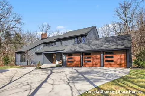 Exterior - 400 Greentree Ln NE, Ada, MI 49301 photo 2 of 14