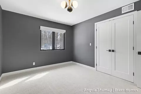 Bedroom - 400 Greentree Ln NE, Ada, MI 49301 photo 5 of 5