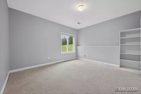 Bedroom - 57 Rollingbrook Dr NE, Ada, MI 49301 photo 2 of 7