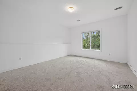 Bedroom - 57 Rollingbrook Dr NE, Ada, MI 49301 photo 3 of 7