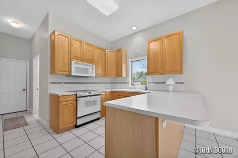 Kitchen - 57 Rollingbrook Dr NE, Ada, MI 49301 photo 2 of 4